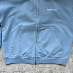 Balenciaga light blue zip-up hoodie with kangaroo pocket and center zipper