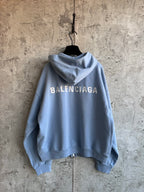 Balenciaga light blue hoodie with large BALENCIAGA logo on back