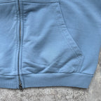 Balenciaga light blue zip-up hoodie detail with ribbed hem and zipper pull