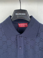 Navy polo shirt collar with two-button placket and red Gucci neck label