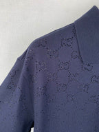 Navy polo shirt shoulder with dotted GG logo pattern