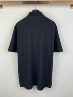 Navy Burberry short-sleeve polo shirt from back view with curved hem