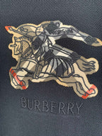 Burberry horse graphic embroidery on navy polo shirt with multicolor accents