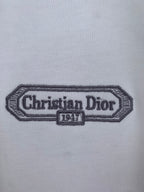 Embroidered Christian Dior 1947 logo patch on white T-shirt