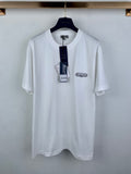 White short-sleeve T-shirt with Dior logo chest patch, on a hanger