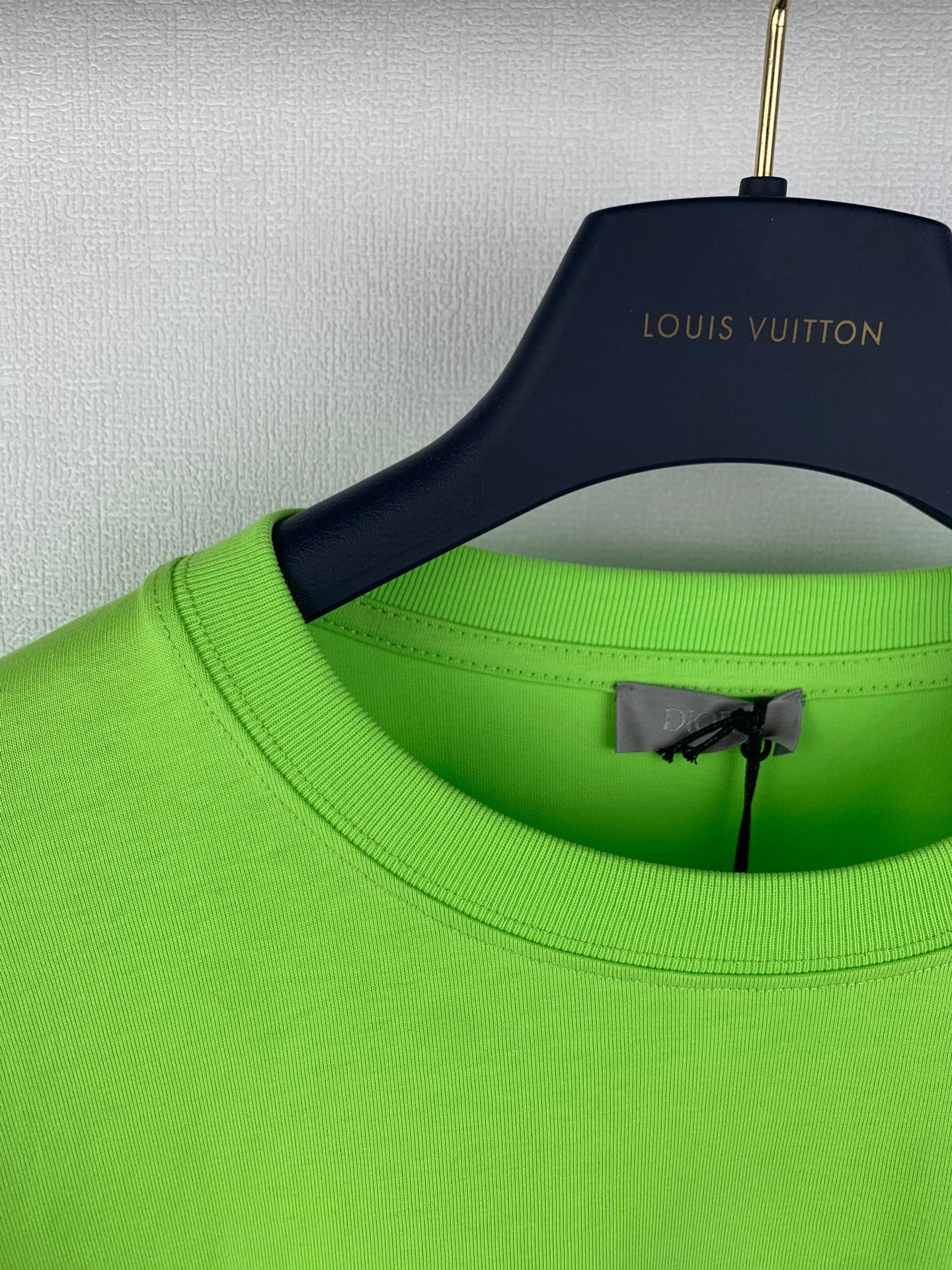 Neon green T-shirt crew neck detail with inner label