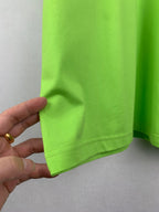Neon green T-shirt hem with stitched edge, side view