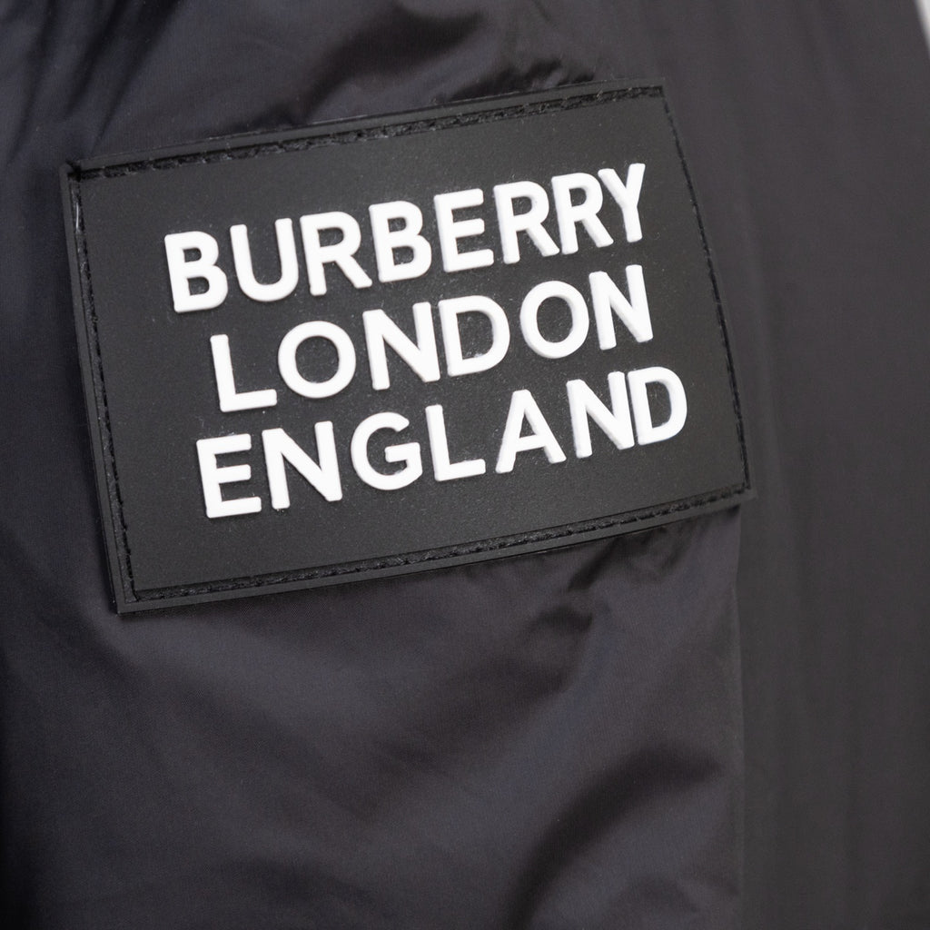 Burberry London England logo label on black puffer jacket