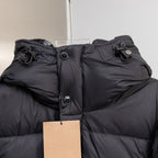 Black hooded puffer jacket hood with drawcord and snap buttons