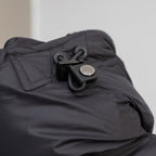 Black puffer jacket hood attachment with drawcord and snap hardware