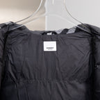 Black hooded puffer jacket interior lining view with Burberry neck label