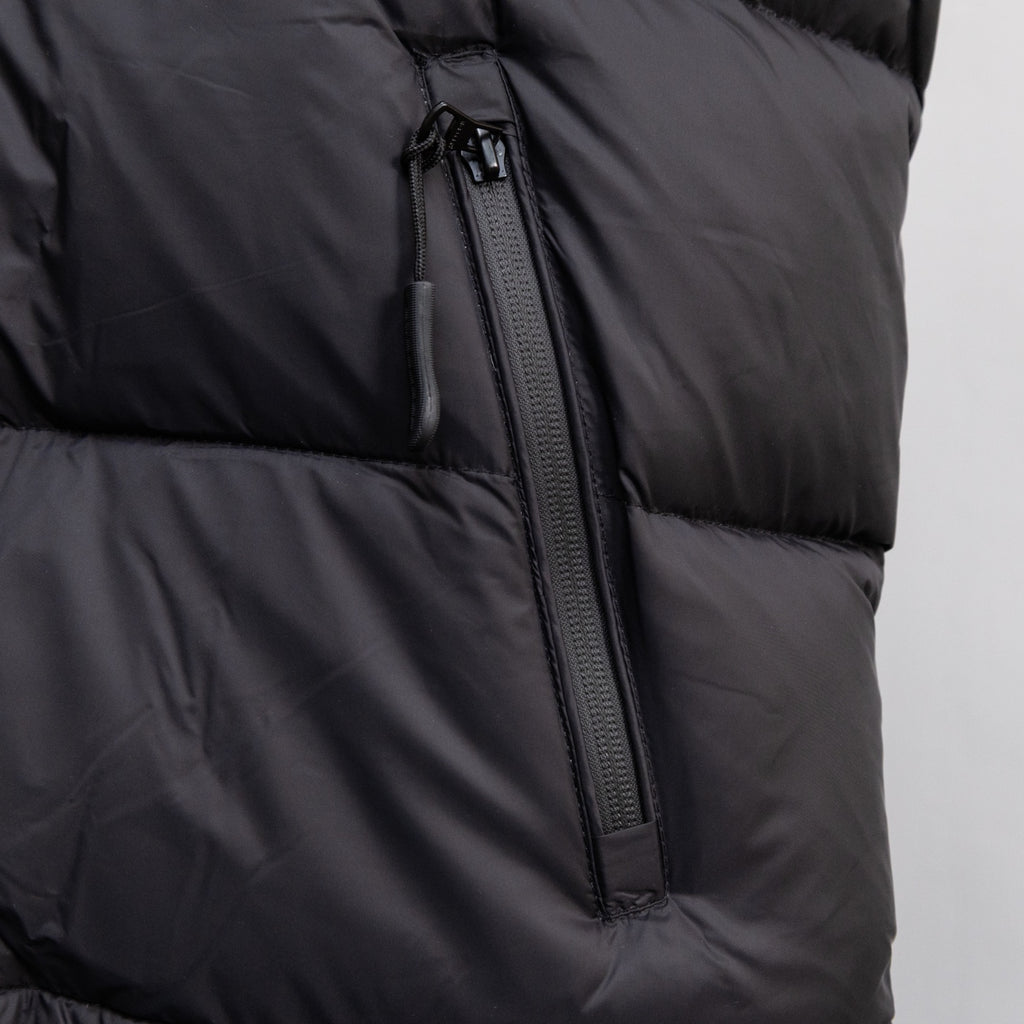 Black sleeveless puffer vest with center front zipper and seam details