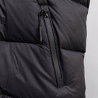 Black sleeveless puffer vest with center front zipper and seam details