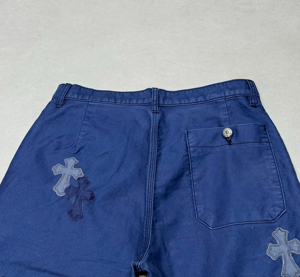 Blue pants rear waistband with cross patch and back pocket