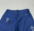 Blue pants rear waistband with cross patch and back pocket