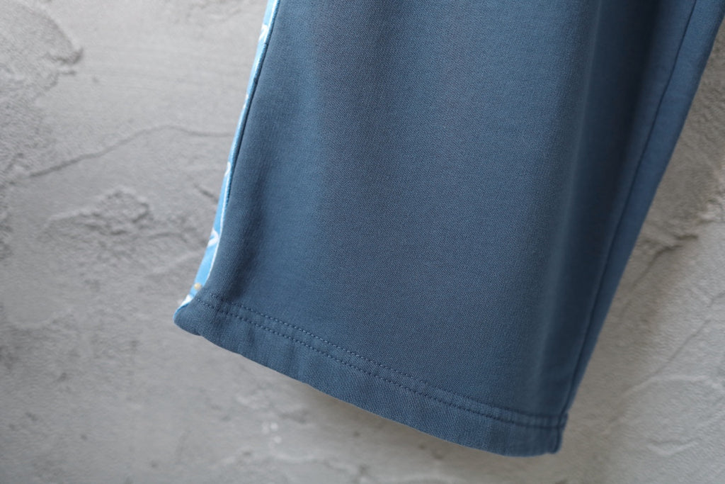 Blue pants hem with stitched cuff detail