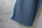 Blue pants hem with stitched cuff detail
