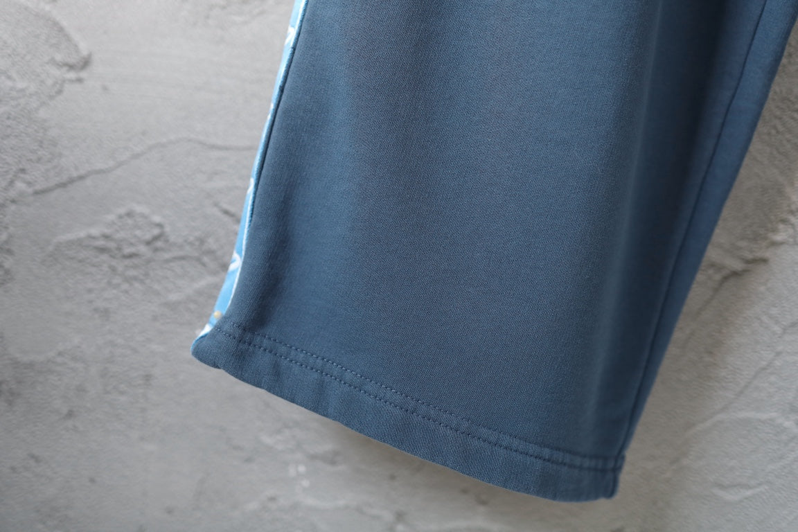 Blue pants hem with stitched cuff detail