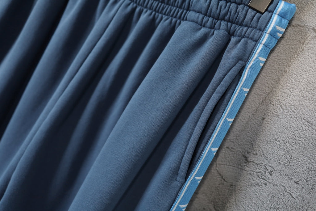 Blue pleated pants with contrast side stripe detail