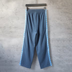 Blue wide-leg pants with elastic waistband and contrast side stripe panels