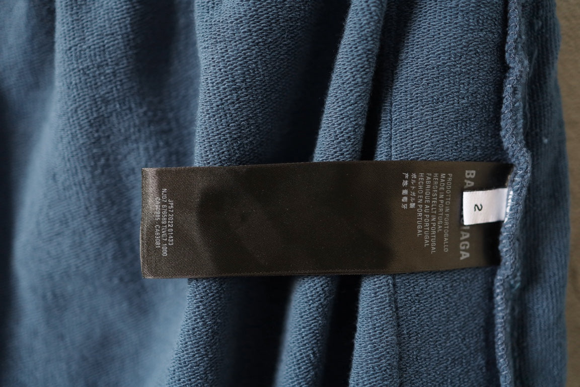 Blue pants with interior brand size label near waistband