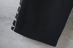 Balenciaga pants hem with black fabric and white side trim