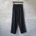 Balenciaga pants with elastic waistband and wide legs, black with white logo side trim