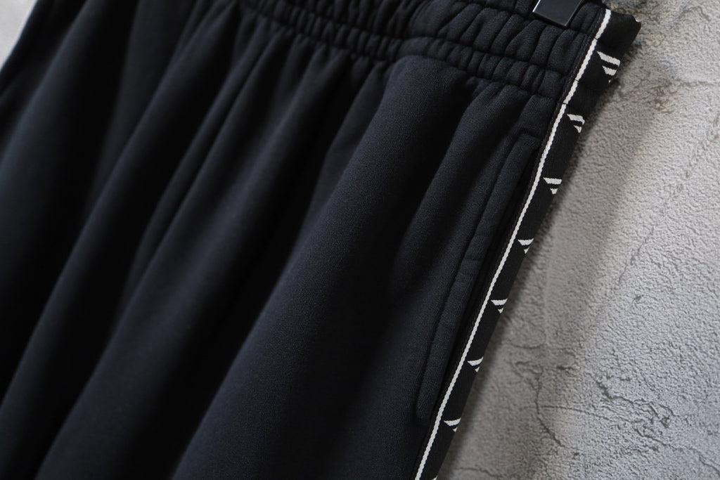 Balenciaga pants upper leg with black fabric and white logo side stripe