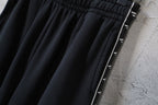 Balenciaga pants upper leg with black fabric and white logo side stripe