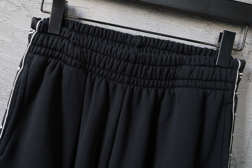Balenciaga pants waistband with gathered elastic and white side piping, black
