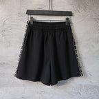 Balenciaga black shorts with elastic waistband and side stripe trim