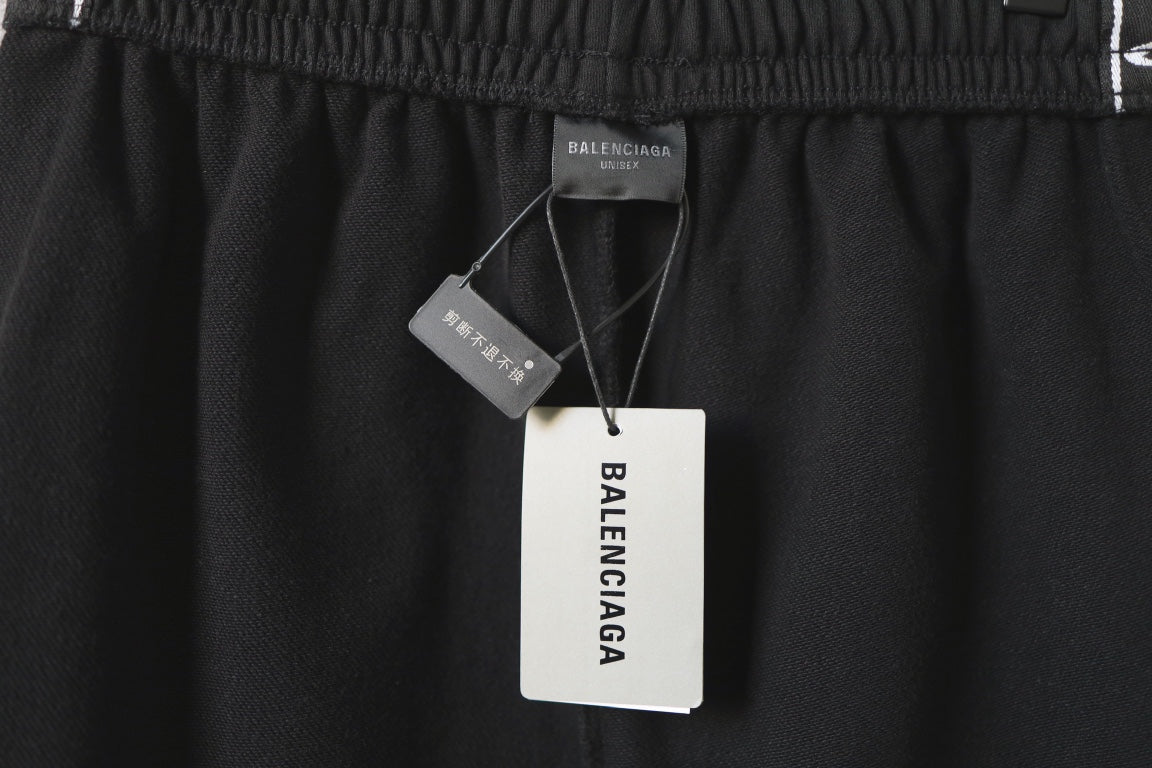 Balenciaga black shorts with interior size and brand tags at waistband
