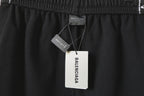 Balenciaga black shorts with inner neck tag and size label at waist