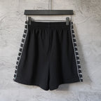 Balenciaga black shorts with elastic waistband and logo side stripe bands