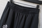 Black pants with ribbed elastic waistband and belt loops