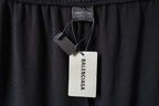 Balenciaga black pants interior with small label and attached hang tags