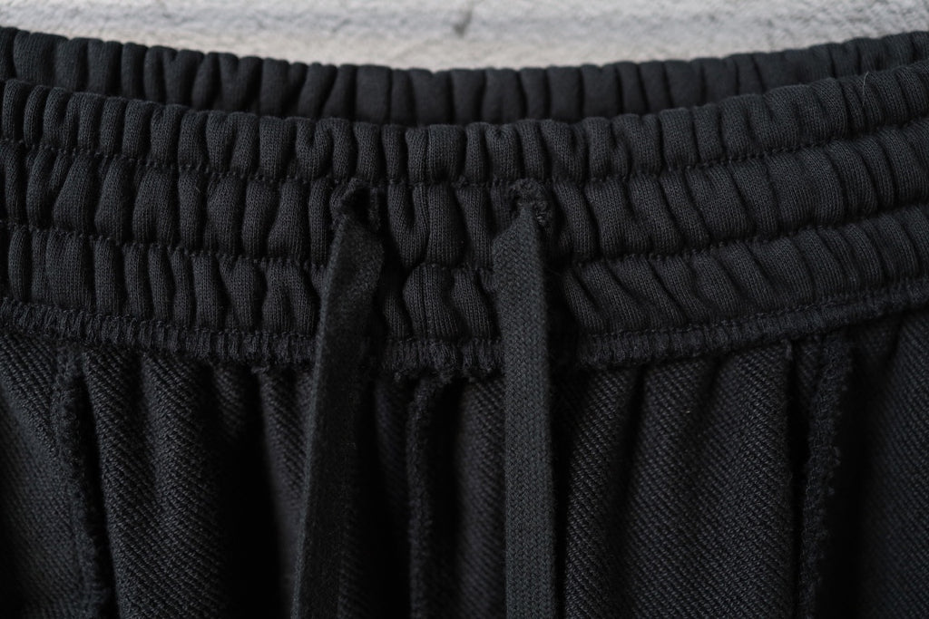 Black pants with elastic waistband and inner drawstring