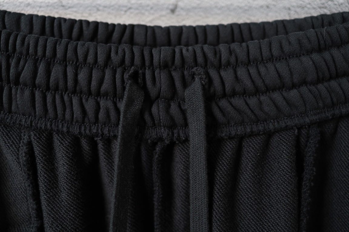Black pants with elastic waistband and inner drawstring