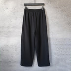 Balenciaga black wide-leg pants with elastic waistband and two front creases