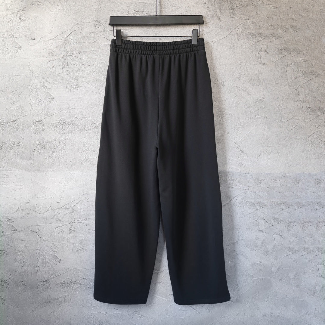 Balenciaga black wide-leg pants with elastic waistband and two front creases