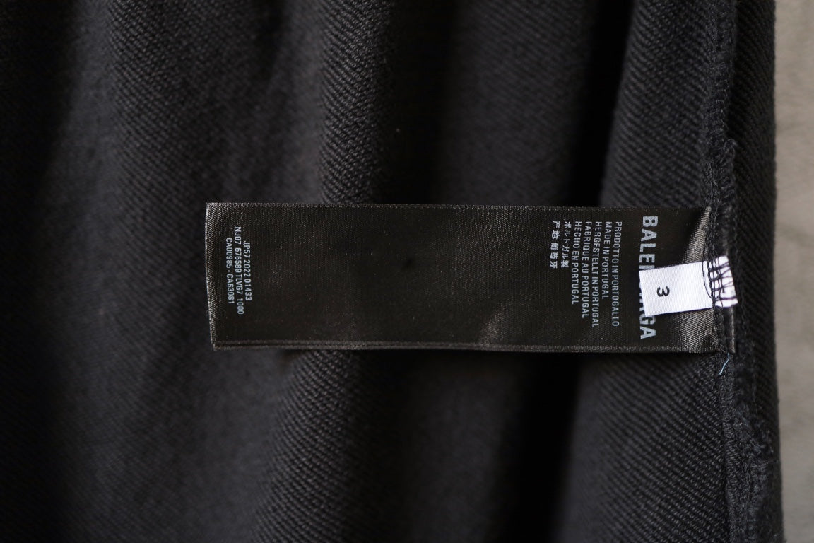 Black pants with side seam size and care label