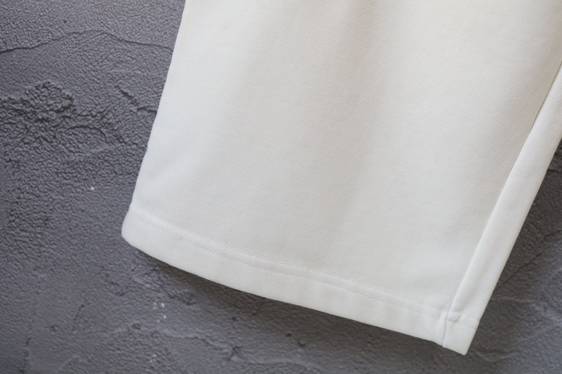 White Balenciaga pants with straight cuffed hem