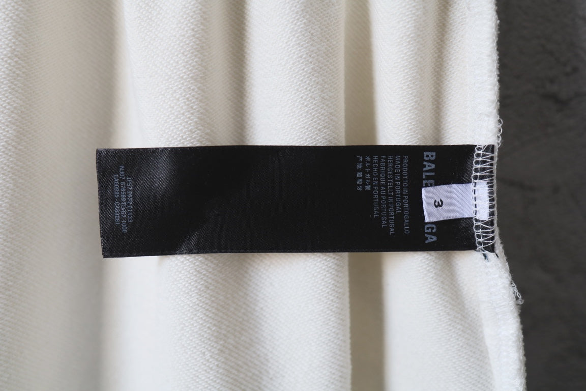 White Balenciaga pants with interior size and care label tag