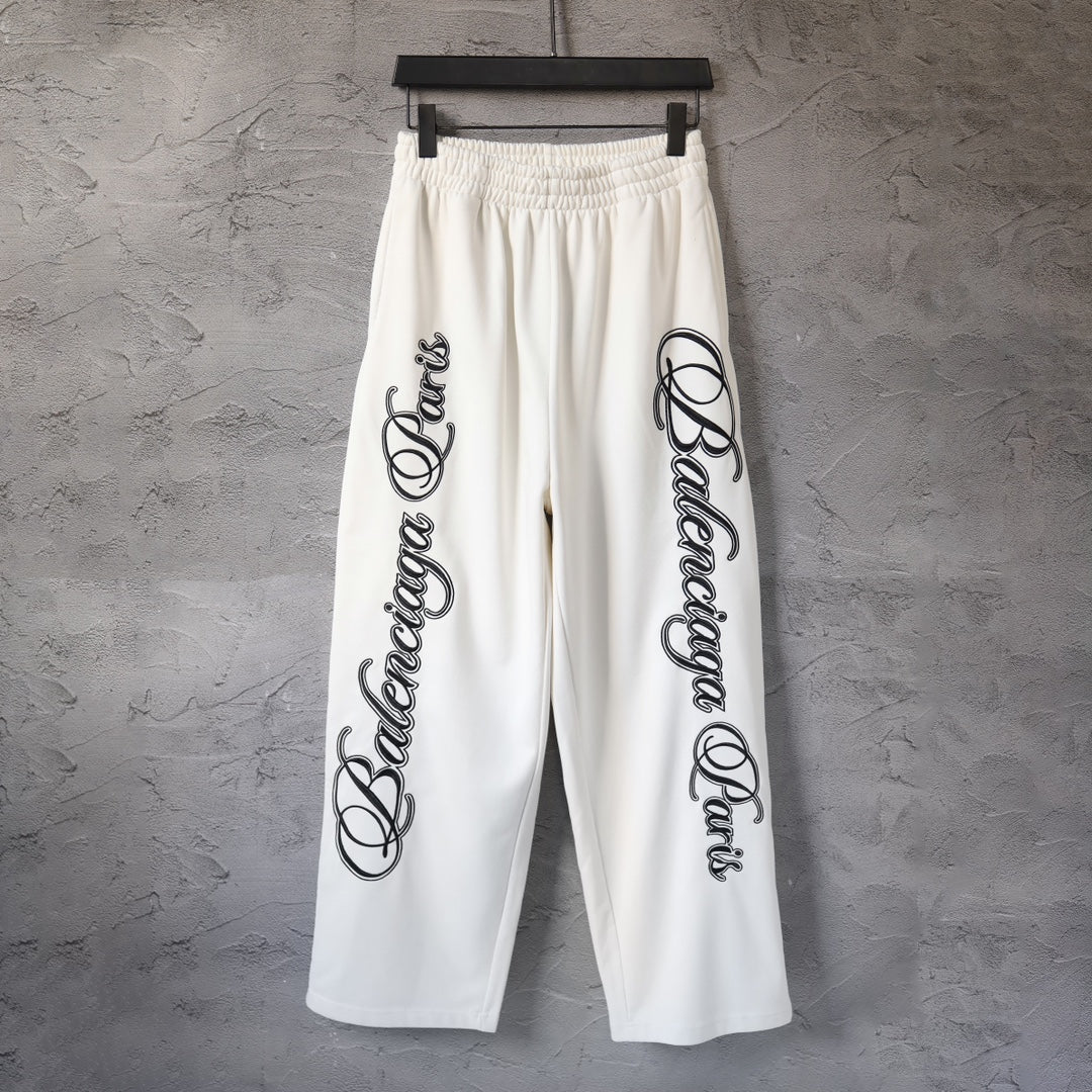 White Balenciaga wide-leg pants with elastic waist and black side logo print