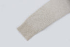 Light beige knit sweater cuff detail, ribbed hem on sleeve