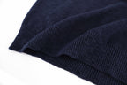Dark navy ribbed hem and knit texture detail on sweater