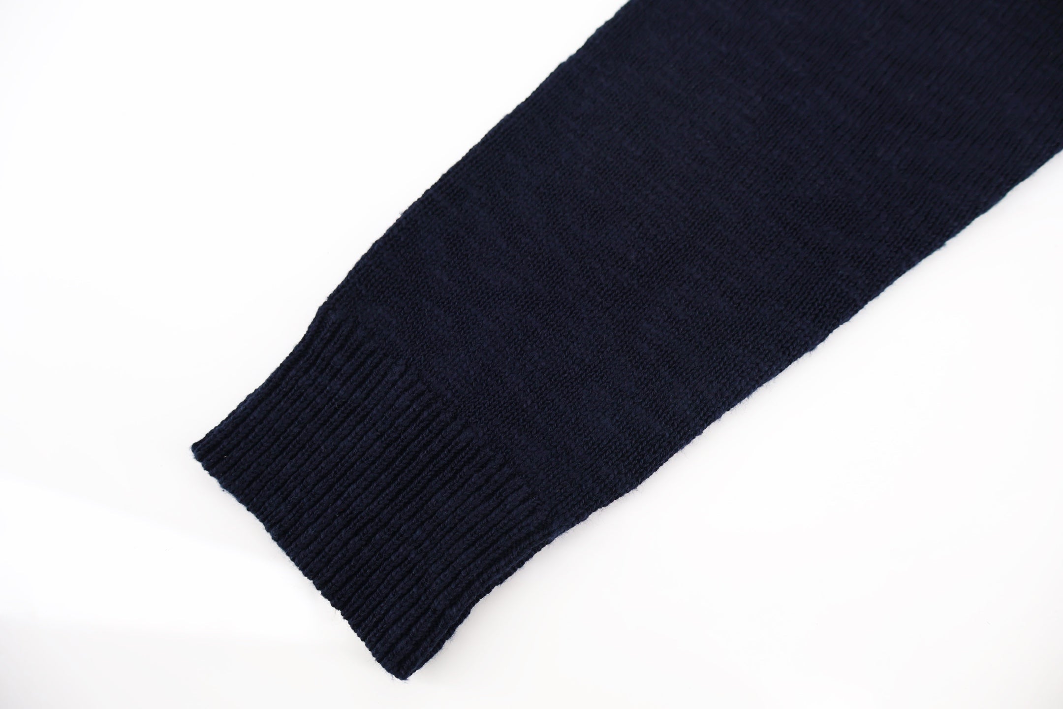 Dark navy ribbed knit sleeve cuff detail