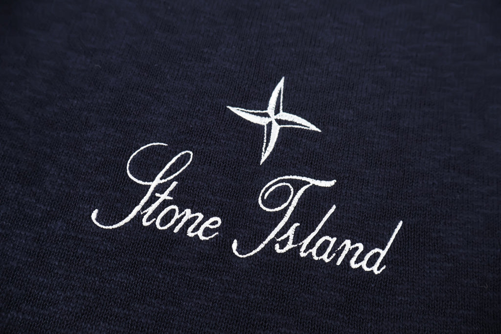 Stone Island star and script logo on dark navy knit sweater