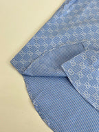 Blue Gucci long-sleeve shirt with allover logo pattern, draped side