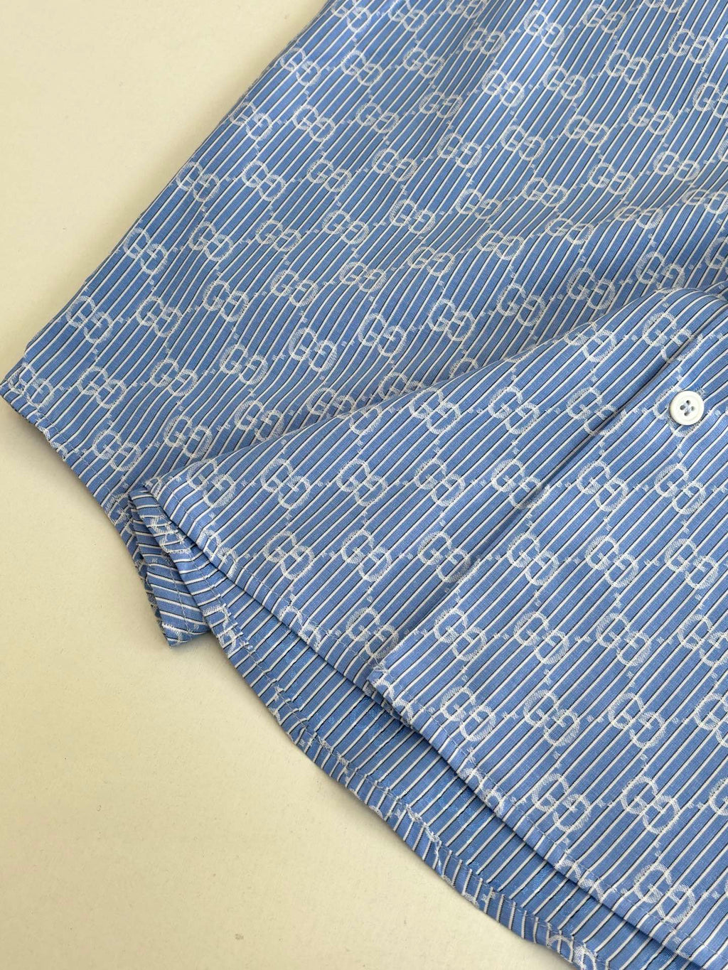 Blue Gucci long-sleeve shirt sleeve with cuff and allover logo pattern